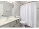 Bathroom features a single sink vanity, toilet and shower with white walls at 3435 E Renee Dr, Phoenix, AZ 85050