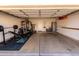 Spacious garage features workout equipment and extra storage at 3435 E Renee Dr, Phoenix, AZ 85050