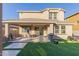 Covered patio complete with ceiling fan and a dining set at 3483 W Verde River Rd, San Tan Valley, AZ 85144