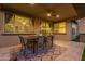 Covered patio featuring travertine flooring, a ceiling fan and an outdoor dining set at 3483 W Verde River Rd, San Tan Valley, AZ 85144