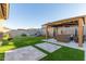 Expansive backyard featuring manicured lawn, covered gazebo, and a play area for Gathering enjoyment at 3483 W Verde River Rd, San Tan Valley, AZ 85144