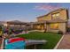 Beautiful backyard featuring a gazebo, a playset, and lush artificial turf at 3483 W Verde River Rd, San Tan Valley, AZ 85144