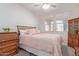 Bedroom with natural light, ceiling fan, and a charming secretary desk at 3483 W Verde River Rd, San Tan Valley, AZ 85144