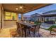 Inviting covered patio with ceiling fan and dining area, perfect for outdoor entertaining at 3483 W Verde River Rd, San Tan Valley, AZ 85144