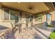 Spacious covered patio extends off the house with outdoor dining at 3483 W Verde River Rd, San Tan Valley, AZ 85144