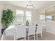 Elegant dining room with a modern chandelier and natural light, perfect for gatherings at 3483 W Verde River Rd, San Tan Valley, AZ 85144