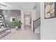 Bright foyer with wood floors, stylish decor, and an inviting view of the staircase and living spaces at 3483 W Verde River Rd, San Tan Valley, AZ 85144