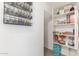 Organized pantry with shelving and spice racks for efficient food and supply storage at 3483 W Verde River Rd, San Tan Valley, AZ 85144