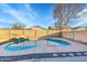 This backyard has a fenced pool and a rock waterfall at 3524 W Alyssa Ln, Phoenix, AZ 85083