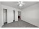 Bedroom with ceiling fan, closet with doors and neutral carpeting at 3524 W Alyssa Ln, Phoenix, AZ 85083