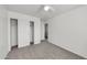 This bedroom features neutral carpet, a ceiling fan, and a closet with sliding doors at 3524 W Alyssa Ln, Phoenix, AZ 85083