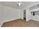 A secondary bedroom boasts wood-look tile and an open closet at 3524 W Alyssa Ln, Phoenix, AZ 85083