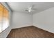 This bedroom offers a ceiling fan and wood-look tile flooring at 3524 W Alyssa Ln, Phoenix, AZ 85083