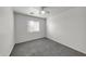 Bedroom with window, carpet, and ceiling fan at 3524 W Alyssa Ln, Phoenix, AZ 85083