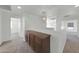 A hallway with carpet and a wooden cabinet with doors at 3524 W Alyssa Ln, Phoenix, AZ 85083