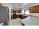 This kitchen features wood cabinets, tile flooring and stainless steel appliances at 3524 W Alyssa Ln, Phoenix, AZ 85083