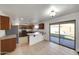 Bright eat-in kitchen features tile flooring, wood cabinetry, and stainless steel appliances at 3524 W Alyssa Ln, Phoenix, AZ 85083