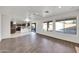 This living room offers tile floors and a view of the kitchen and backyard at 3524 W Alyssa Ln, Phoenix, AZ 85083