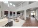 Bright, open-concept living room featuring a soaring ceiling and second-story overlook and modern decor at 3524 W Alyssa Ln, Phoenix, AZ 85083