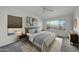 Inviting main bedroom retreat with a ceiling fan and a large window overlooking desert landscaping at 3524 W Alyssa Ln, Phoenix, AZ 85083