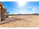 Large backyard, enclosed with a rock border; the building's rear is visible at 3608 N Mansfield Dr, Litchfield Park, AZ 85340