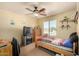 Bedroom with a ceiling fan, window and decorations at 3608 N Mansfield Dr, Litchfield Park, AZ 85340