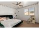 Bedroom featuring bed, ceiling fan, window, and cat climbing tree at 3608 N Mansfield Dr, Litchfield Park, AZ 85340