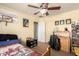 Bedroom with ceiling fan, closet, and display shelving at 3608 N Mansfield Dr, Litchfield Park, AZ 85340