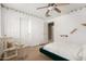 Bedroom featuring closet, ceiling fan, bed, and cat climbing tree at 3608 N Mansfield Dr, Litchfield Park, AZ 85340