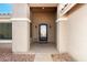 Inviting front entrance with a decorative iron door and a covered porch at 3608 N Mansfield Dr, Litchfield Park, AZ 85340