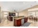 Open kitchen with bar seating, seamlessly connecting to the living and dining areas for easy entertaining at 3608 N Mansfield Dr, Litchfield Park, AZ 85340