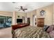 Comfortable main bedroom with a decorative bed and a sliding glass door leading to the patio at 3608 N Mansfield Dr, Litchfield Park, AZ 85340