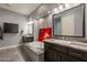 Elegant bathroom with dual vanities, a soaking tub, and recessed lighting, creating a spa-like retreat at 36276 N Secret Garden Path, Queen Creek, AZ 85140