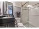 Clean bathroom with glass shower, granite sink, and black-and-white mosaic tile floor at 36276 N Secret Garden Path, Queen Creek, AZ 85140