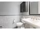 Stylish bathroom with marble-patterned walls and a pedestal sink, offering a blend of classic design and modern amenities at 36276 N Secret Garden Path, Queen Creek, AZ 85140