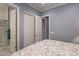 Serene bedroom featuring an en-suite bathroom and spacious closet at 36276 N Secret Garden Path, Queen Creek, AZ 85140