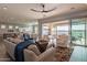 Inviting living room with open layout and seamless indoor/outdoor living with lake views at 36276 N Secret Garden Path, Queen Creek, AZ 85140