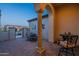 Covered patio showcases neutral columns, tiled flooring, and outdoor seating for relaxed living at 36276 N Secret Garden Path, Queen Creek, AZ 85140