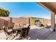 Backyard patio with seating and a grill, perfect for outdoor entertaining at 3792 E Westchester Dr, Chandler, AZ 85249