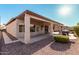 Exterior of backyard patio with shade roof and desert landscaping at 3792 E Westchester Dr, Chandler, AZ 85249