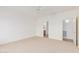 Spacious carpeted bedroom with white walls and ceiling fan at 3792 E Westchester Dr, Chandler, AZ 85249