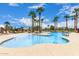 Large community pool features ample seating and stunning palm tree landscaping at 3792 E Westchester Dr, Chandler, AZ 85249