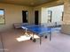 Outdoor game area featuring a ping pong table and patio seating, perfect for recreation at 3792 E Westchester Dr, Chandler, AZ 85249