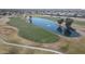 Panoramic aerial view of a lush golf course and community lake with water features at 3792 E Westchester Dr, Chandler, AZ 85249