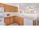 Bright kitchen with plenty of counter space and white appliances at 3792 E Westchester Dr, Chandler, AZ 85249