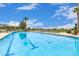 Long community lap pool perfect for exercise with lane markers and poolside seating at 3792 E Westchester Dr, Chandler, AZ 85249