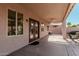 Covered outdoor patio featuring a ceiling fan and stylish outdoor lighting at 3792 E Westchester Dr, Chandler, AZ 85249