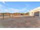 Large home backyard surrounded by gravel and a large shed at 38024 N 15Th Ave, Phoenix, AZ 85086