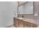 Modern bathroom featuring wood cabinets, granite countertops, sink, and towel rack at 38024 N 15Th Ave, Phoenix, AZ 85086