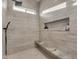 Large walk-in shower with bench, showerhead and handheld showerhead at 38024 N 15Th Ave, Phoenix, AZ 85086